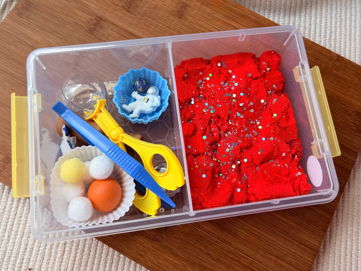 Space themed sensory bin for kids. Kinetic sand sensory bin for kids 