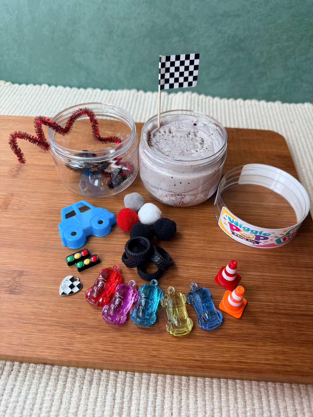 Race car themed play jar. Race car sensory jar. Travel sensory jar. Travel toys. 