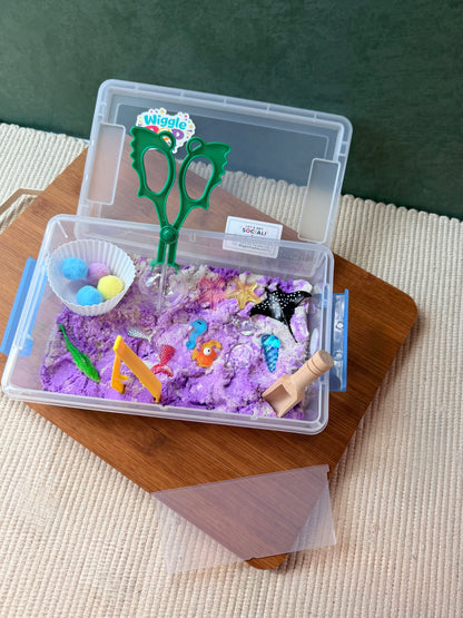 Ocean theme taken place sensory kit includes all tools needed for sensory play. The base is kinetic sand.