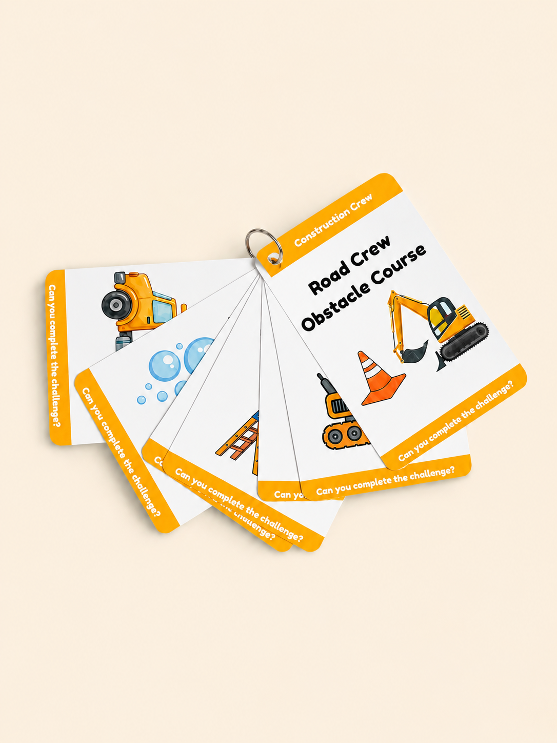 A set of construction-themed obstacle course cards fanned out on a light beige background. The cards are white with bright orange borders and feature illustrations of construction vehicles and equipment, with the top card reading 'Road Crew Obstacle Course'.