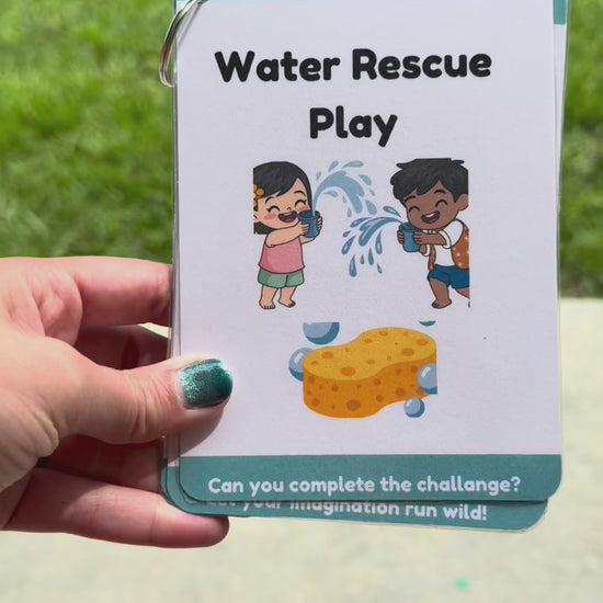 Video of the items inside the splash and wiggle play box including activity card play prompt packet, 6 sponge balls, 2 bowls, a bubble wand, a feed the shark page, 6 toss bean bags, a growing ocean creature, a pair of mini tongs